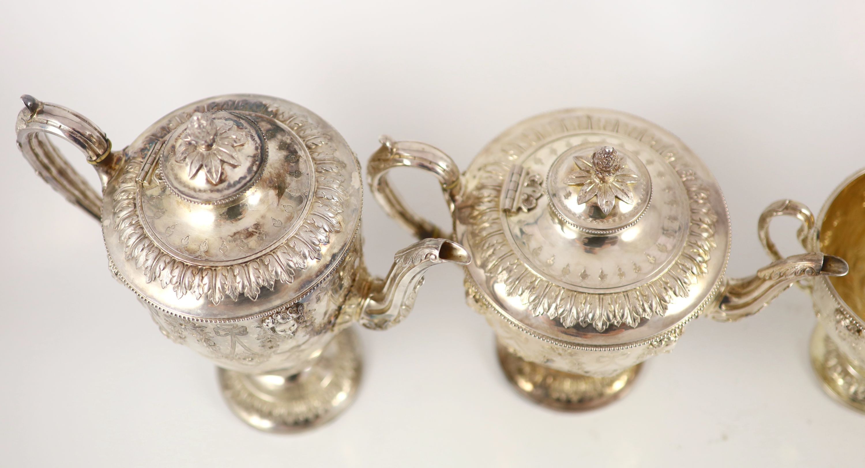 A Victorian embossed silver four-piece tea and coffee service of classical vase form, London 1886, Martin, Hall & Co (Richard Martin & Ebenezer Hall)